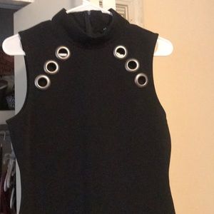 Form fitting black dress . Very elegant